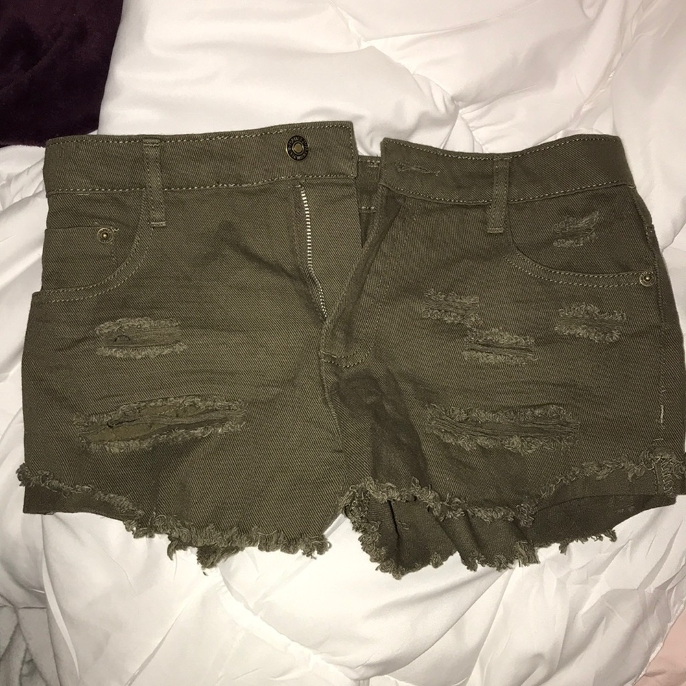 Army green ripped shorts